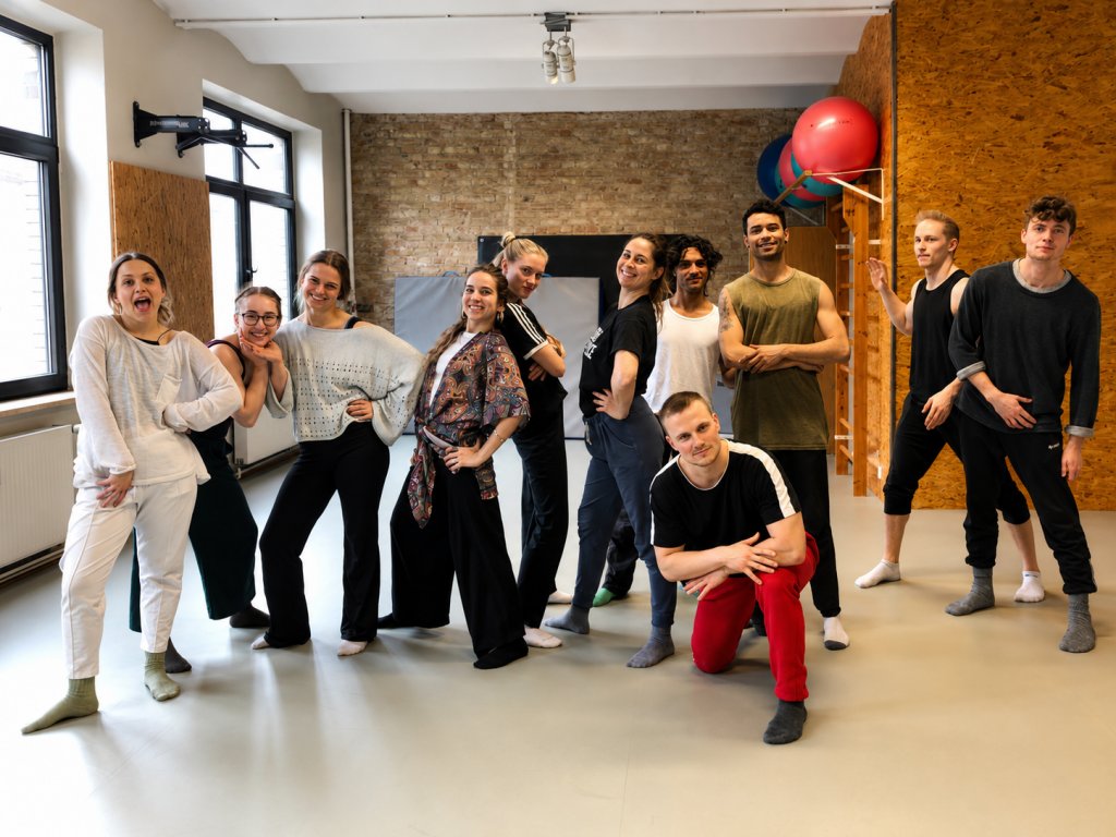 Participants in a physical performance and speech masterclass with David Cassel in a rehearsal studio